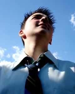 young executive with sky and clouds