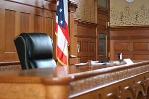 Courtroom with judges table and American flag