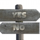 Yes and No sign post with directional arrows